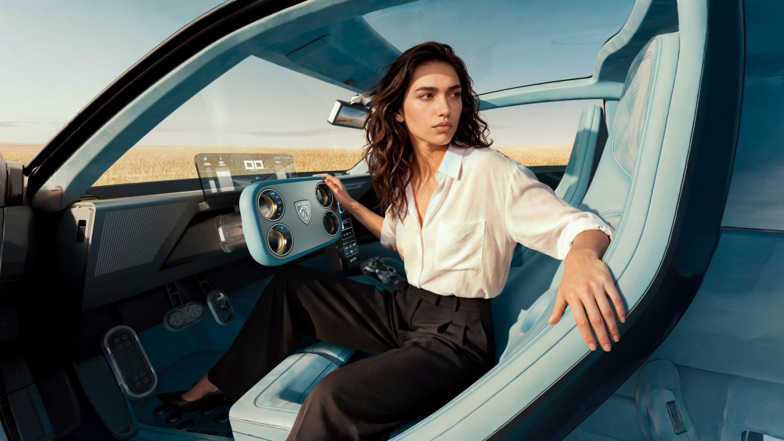 Woman sitting inside a Peugeot concept car with the Hypersquare steer-by-wire control visible.